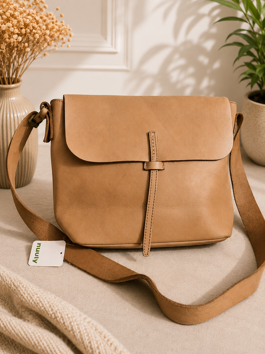 The brand embossed on the bag appears to read “Idea Works”.

Idea Works Tan Leather Crossbody Bag – Pre-Loved Collection
